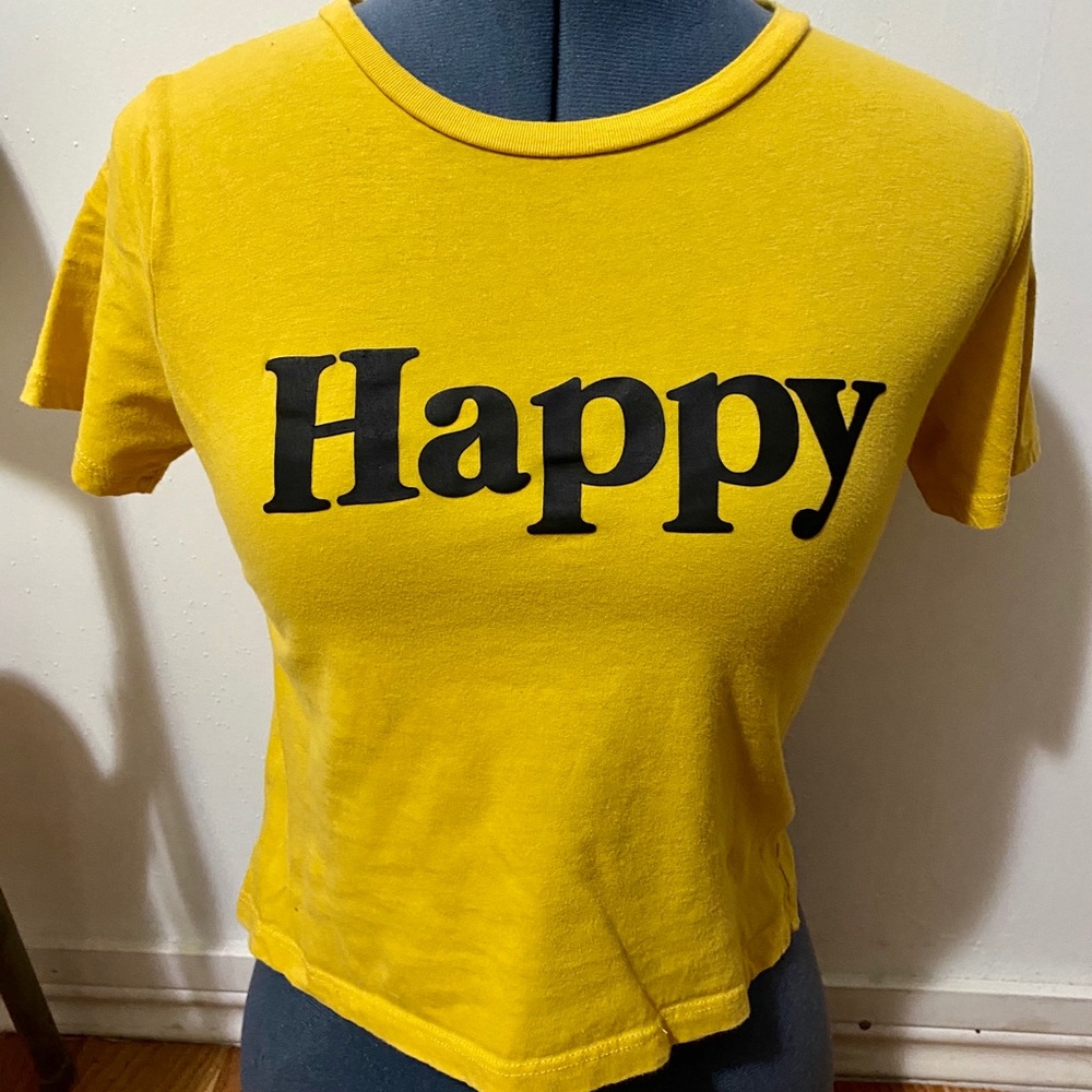 Yellow shirt with happy logo